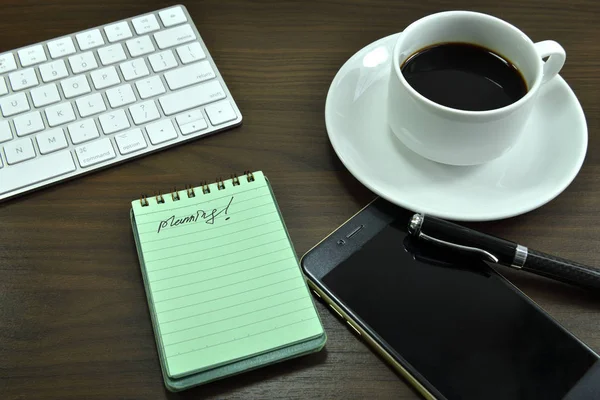 Working desk table with black coffee cup. Top view with copy space