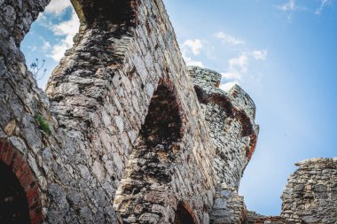 Window frame with a view from the castle. Ruins of a medieval castle. Old castle. A stronghold made of stone on the hill.