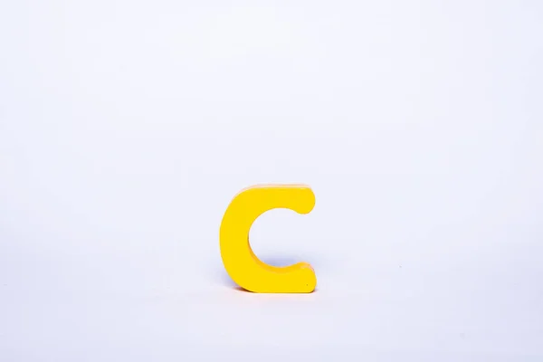 Single Yellow Letter White Background Isolated Wooden Alphabet Letter — 스톡 사진