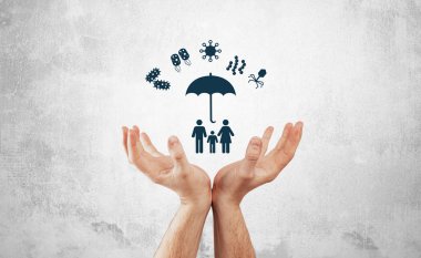 Protection against germs, viruses. Medical and pharmaceutical concept, hands hold the family icon covered with umbrella protecting against bacteria, viruses. Disease prevention. clipart