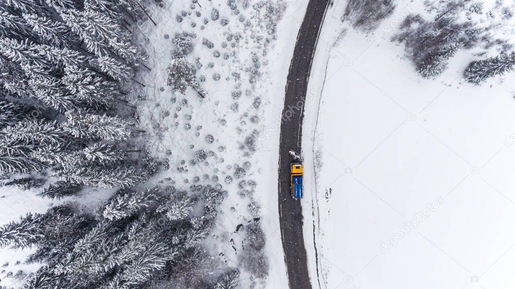 Winter Road in forest from Bird's Eye View