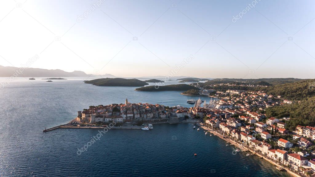  Aerial view of the popular old town of Korcula at sunrise.
