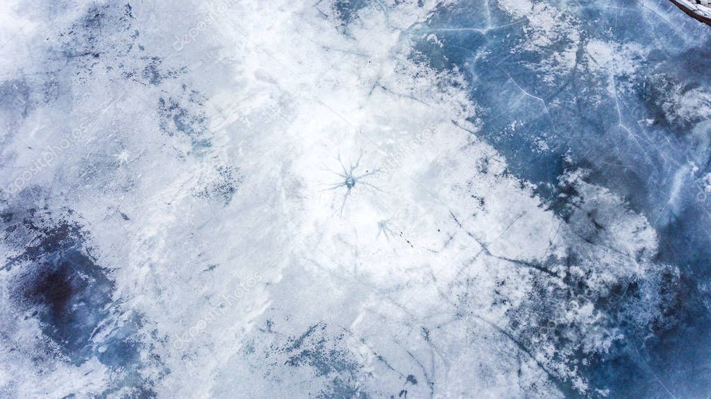 Snowflake texture on icy lake. Shoot from 20 meters height with drone  