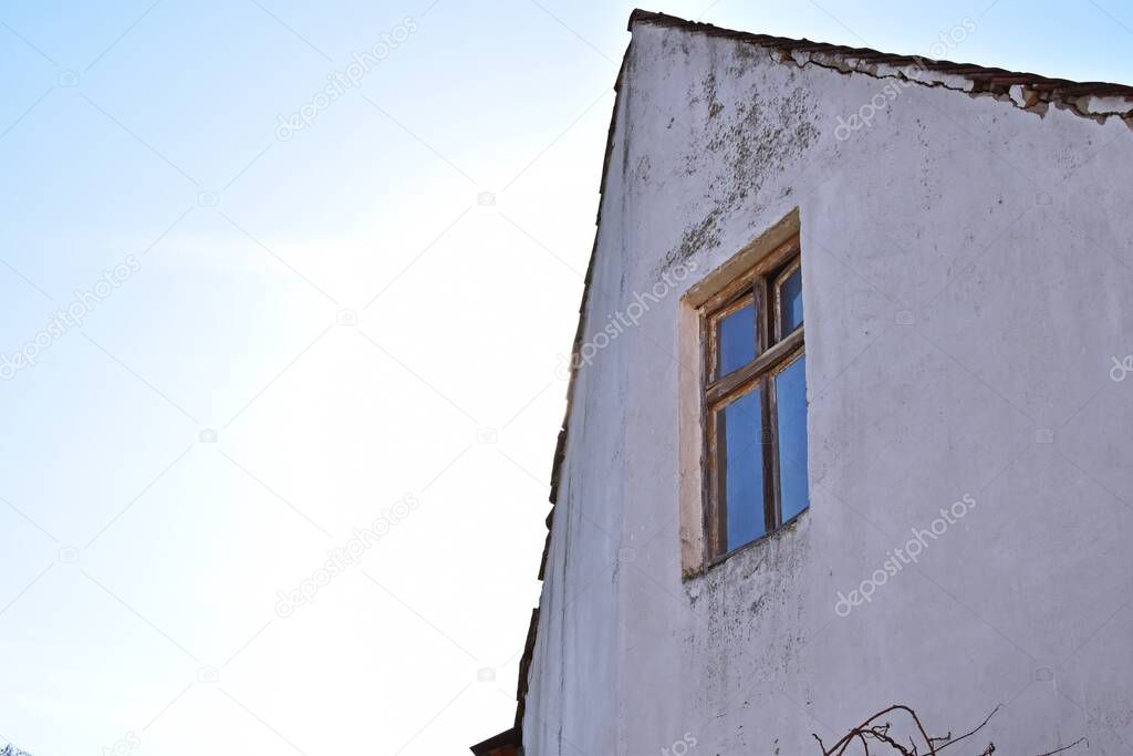 old window in an empty house in a winter