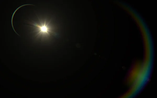 Lens flare light over black background. easy to add overlay or screen filter over photos — Stock Photo, Image