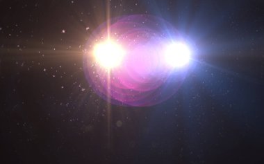 Siyah arkaplan üzerinde mercek ışığı parlıyor.