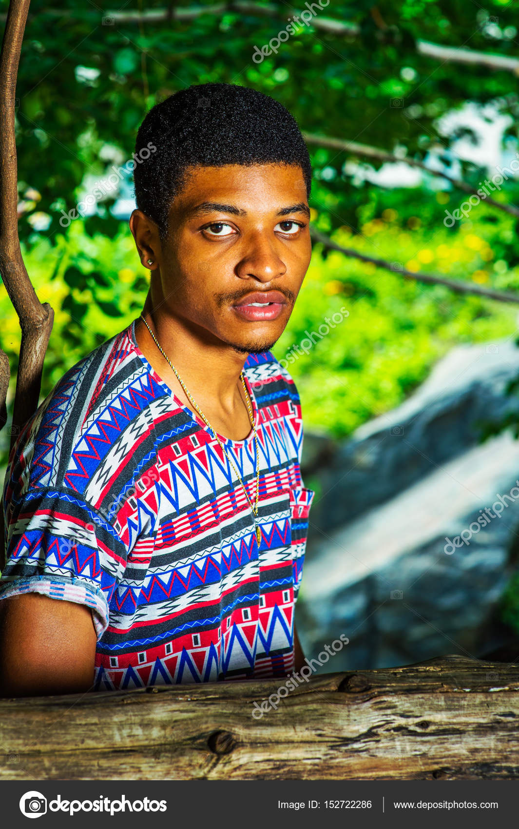 Young African American Man Traveling Relaxing At Central Park
