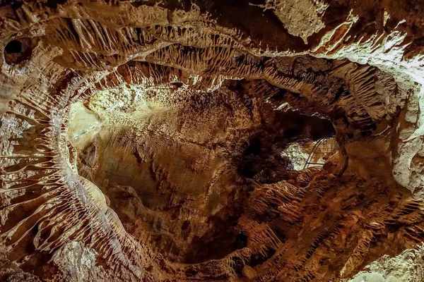 Fantastic stalactite caves and wall relief. — Stock Photo, Image