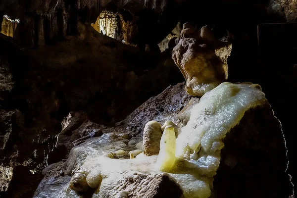 Fantastic stalactite caves and wall relief. — Stock Photo, Image