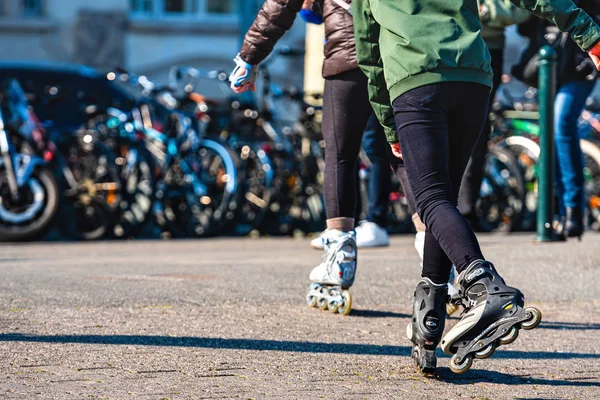 Geneva, Switzerland - April 14, 2019: teenager roller skating on city street, closeup of legs — Stock Photo, Image