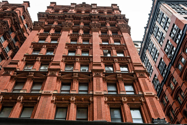 Red facade of a typical brownstone building, Manhattan, New York City, USA