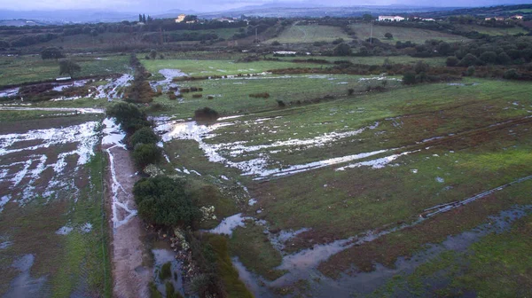 top view with the drone of flooded fields and river overflowed after a severe storm