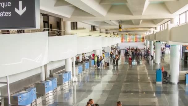 A time lapse hyperlapse of a check in at the airport with people moving in summer deliver documents and suitcase cases — 图库视频影像