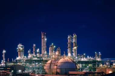 Petrochemical plant and storage sphere tanks with twilight sky background, Manufacturing plant of oil and gas refinery industrial, Glitter lighting of industry plant clipart