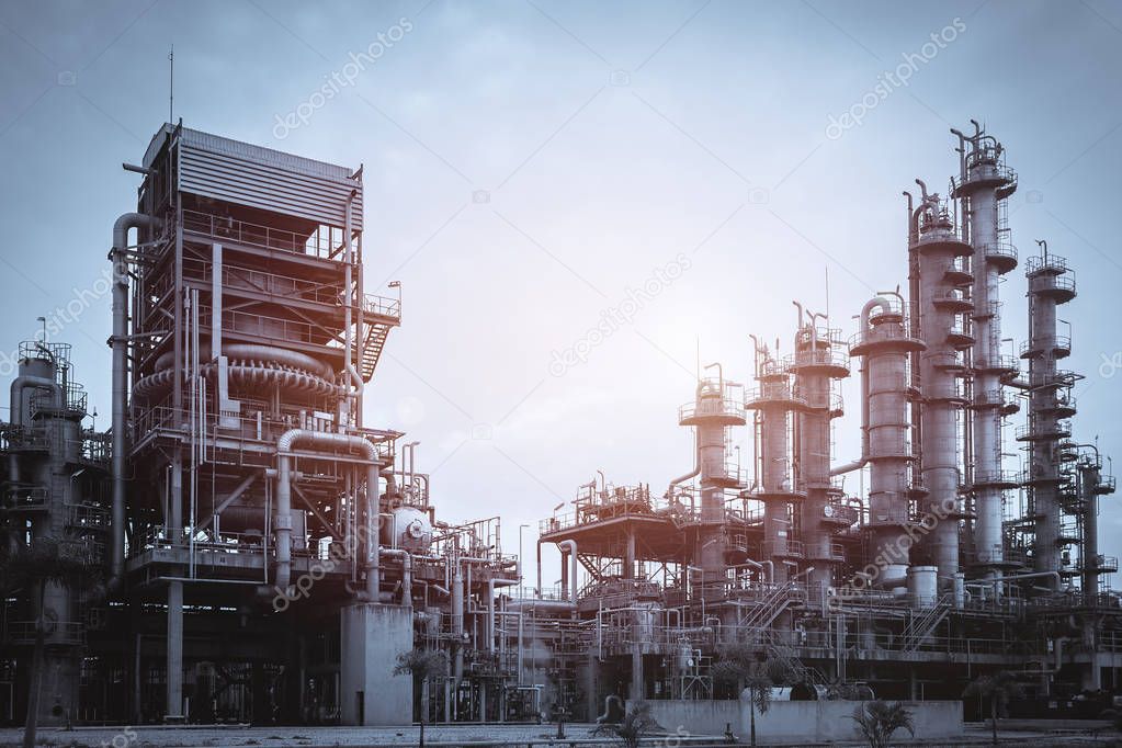 Manufacturing industry plant with production line and gas distillation tower on retro vintage effect