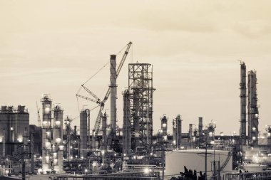Oil and gas refinery plant or petrochemical industry, Heavy equipment in petroleum industrial plant with monotone