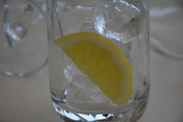 lemon and ice in a glass glass,