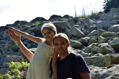 dad and daughter on the background of nature