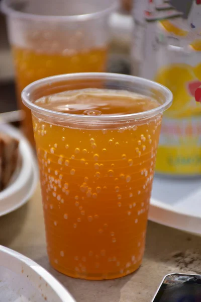 carbonated drink in a disposable cup