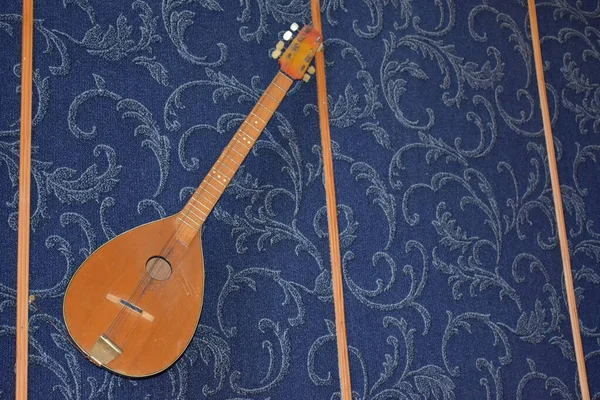 Closeup View Lute Musical Instrument Blue Textile Background — стоковое фото