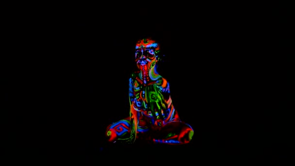 Beautiful young sexy girl in lingerie dancing with ultraviolet paint on her body. Girl with neon bodyart in color light. — Stock Video