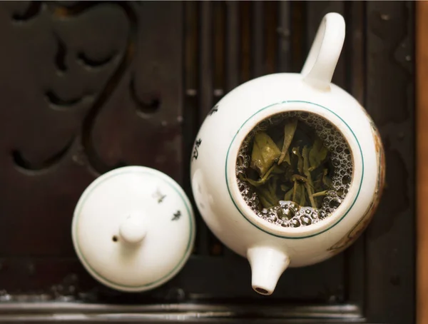 Pouring of Exquisite Green Tea from Teapot at Traditional Chinese Tea Ceremony. Set of Equipment for Drinking Tea — Stock Photo, Image