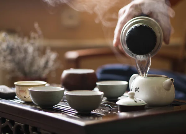 Pouring of Exquisite Hot Tea in Teapot at Traditional Chinese Tea Ceremony. Set of Equipment — Stock Photo, Image