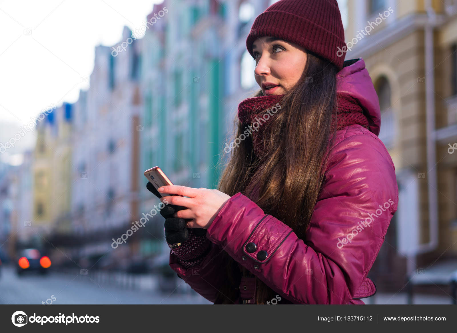 Pretty Brunette Girl Wearing Purple Winter Coat Hat And Scarf