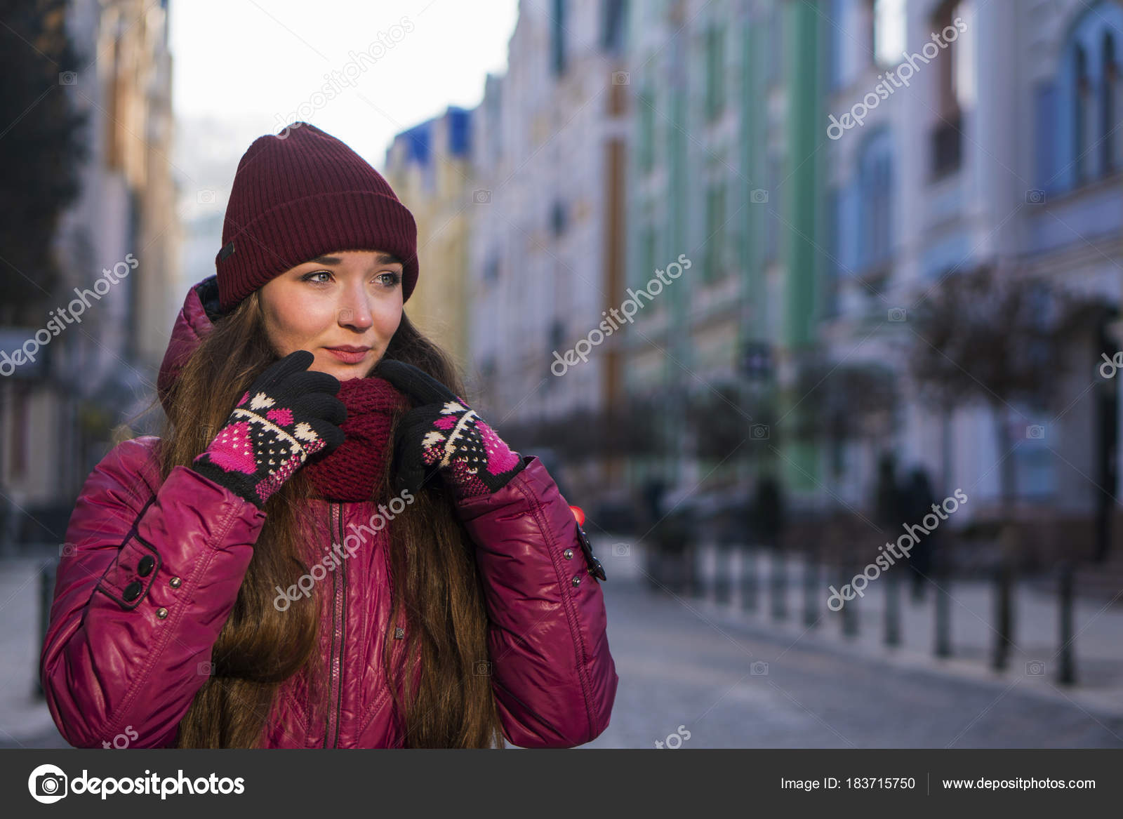 Pretty Brunette Girl Wearing Purple Winter Coat Hat And Scarf