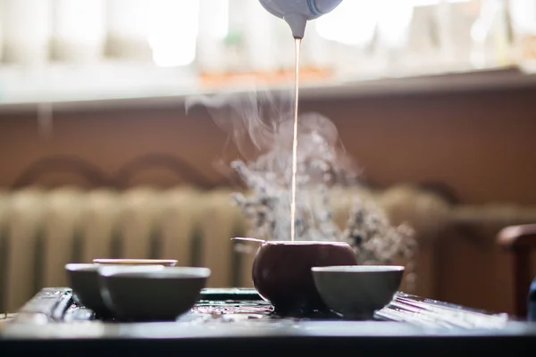 Pouring of Puer Tea from Teapot at Traditional Chinese Tea Ceremony. Set of Equipment for Drinking Tea — Stock Photo, Image