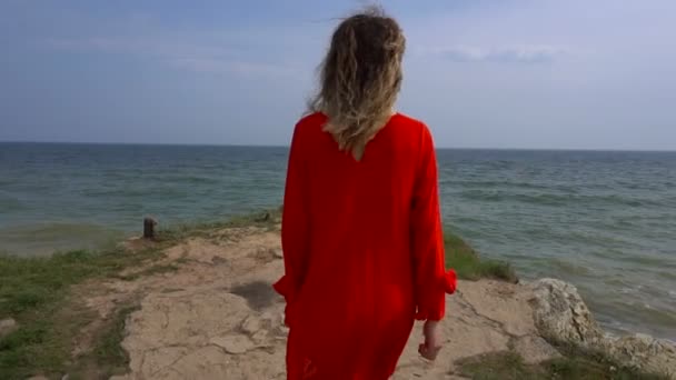 Happy Young Woman in Red Dress Have Fun at the Sea Coast Cliff — Stock Video