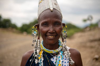 TANZANIA, MASAI VILLAGE - JANUARY 2020: Portrait of Maasai woman people in native masai village Engare Sero on the coast of Natron Lake in Maasailand, Arusha district