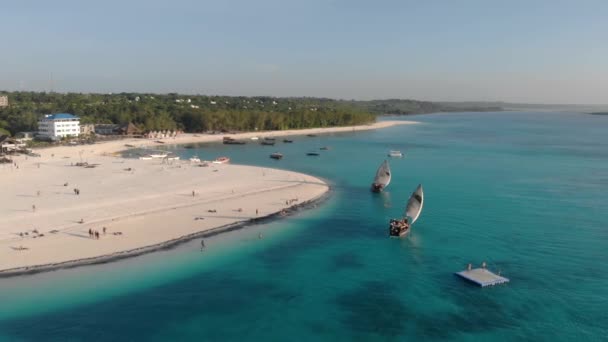 Traditional Africal Sailboats at Zanzibar Kendwa beach at evening time with blue Indian ocean aerial view — Stock Video