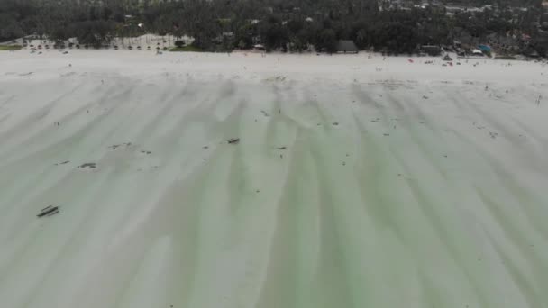 Flying by the Paradise tropical Paje beach at low tide stranded on East Zanzibar island aerial view. Tanzania, Africa — Stock Video