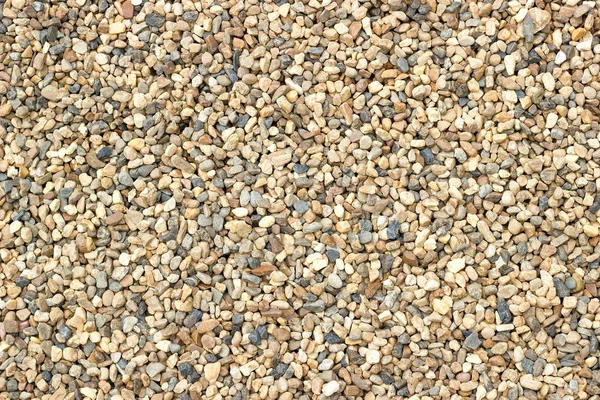 Küçük güzel renkli çakıl taşları çok renkli küçük kayalık arka
