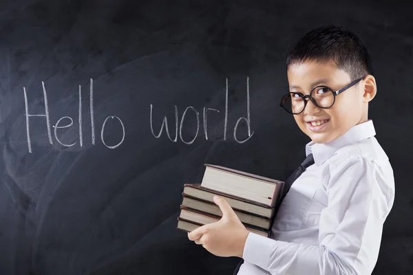 Menino com livros e texto Hello World — Fotografia de Stock