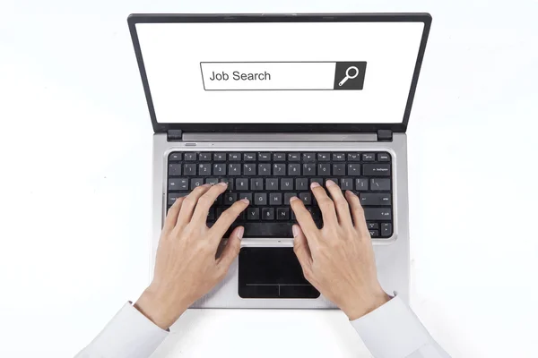 Hand typing job search on the laptop — Stock Photo, Image