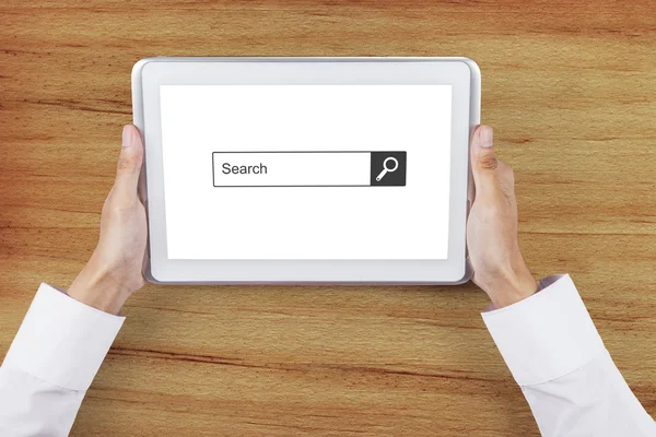 Hand with search box on tablet screen — Stock Photo, Image