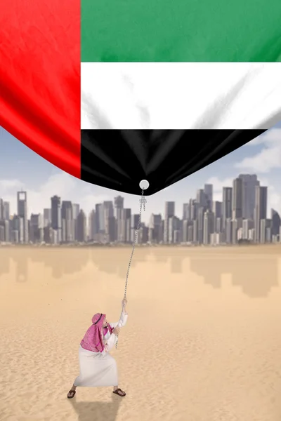 Ember húzza zászló Egyesült Arab Emírségek — Stock Fotó