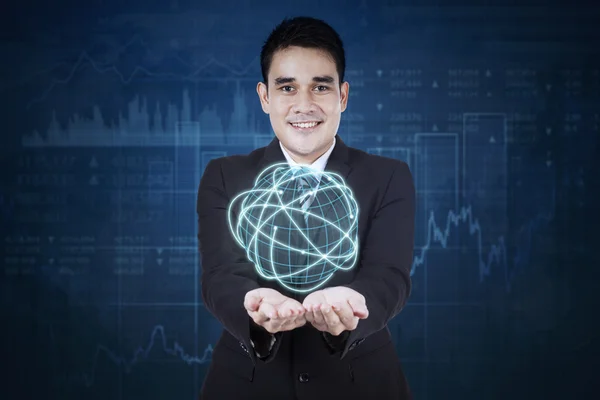 Worker holds globe with internet connection — Stock Photo, Image