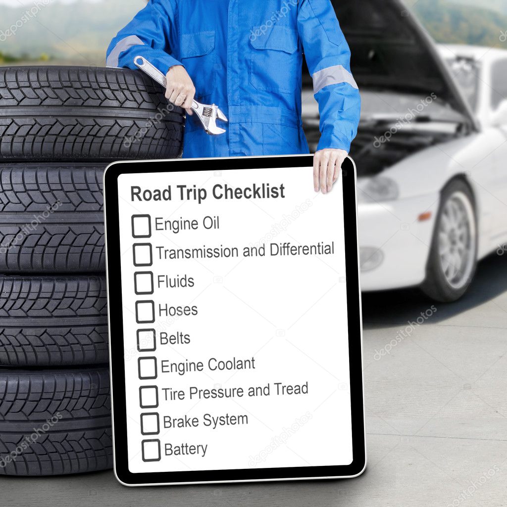 Mechanic with tires and road trip tips