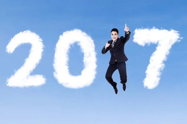 Asian businessman jumping with 2017 — Stock Photo, Image
