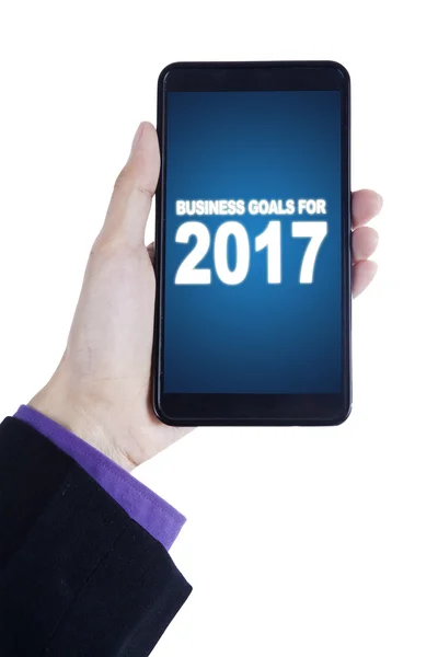 Mano con cellulare e obiettivi per il 2017 — Foto Stock