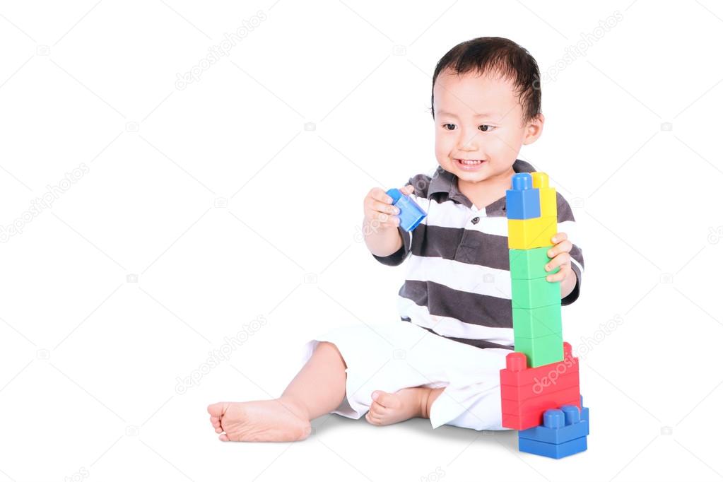 Male toddler playing with toys