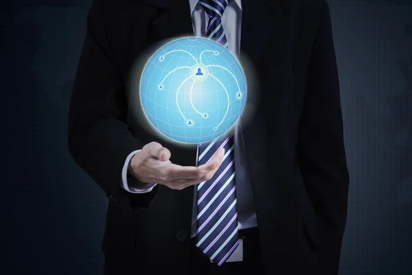 Businessman with 3d earth globe in hand — Stockfoto