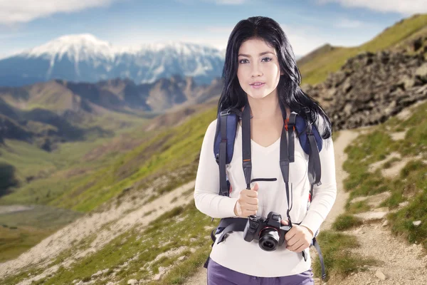 Woman and digital camera with ridge — Stock Photo, Image