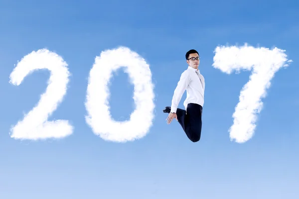 Young businessman leaping with 2017 — Stock Photo, Image