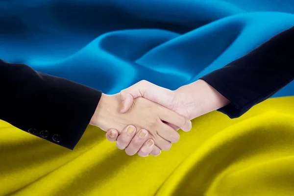 Two business team with Ukraine flag — Stock Photo, Image