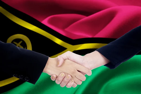 Dwie ręce z flaga Vanuatu — Zdjęcie stockowe