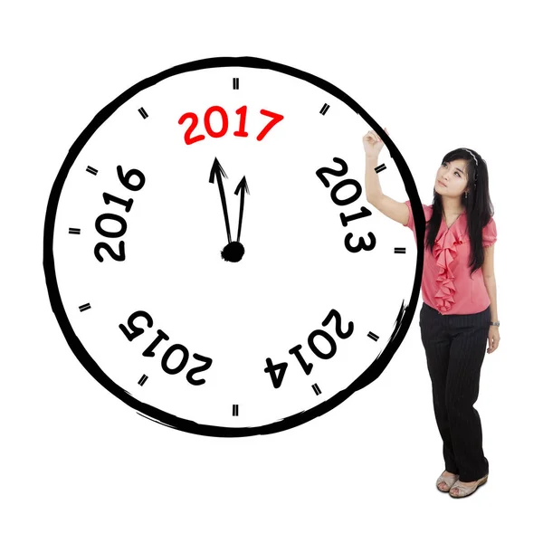Asian businesswoman drawing a big clock — Stock Photo, Image